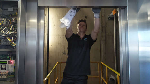 A man cleaning lift